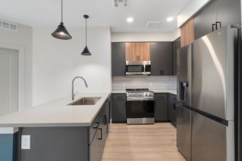 Energy star stainless steel appliances: side-by-side refrigerator* with water and ice dispenser, built-in microwave, dishwasher and ceramic glass cooktop self-cleaning range